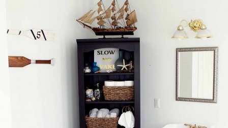 Bright bathroom A dark shelf and nautical decor add elegance to a bright bathroom